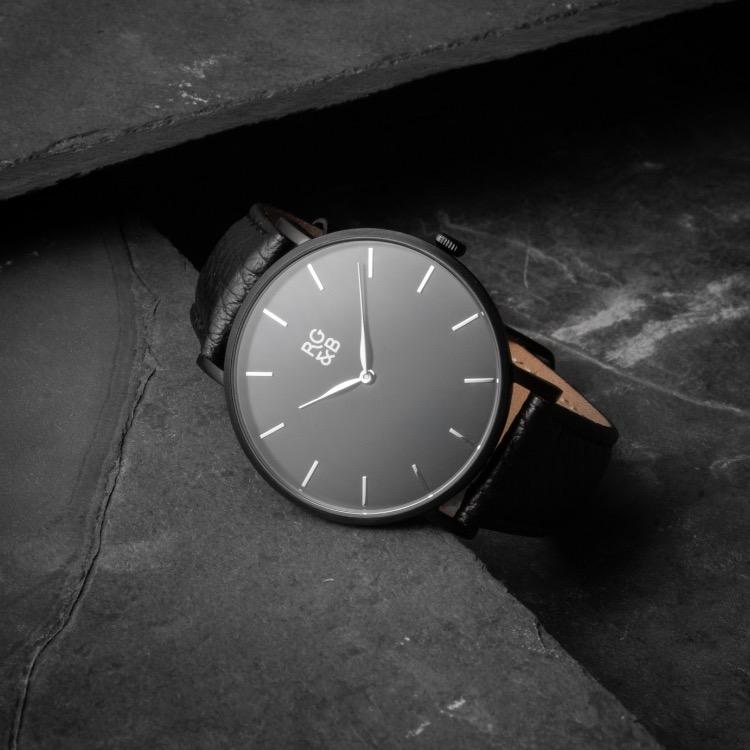 Black Minimal Watch - Explore our Classic Minimal Watch in All Black. Featuring a Brushed Black Case, Gunmetal Hands & Hour Markers, a Black Dial and a Black Leather Strap.